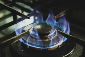 Circle of blue flames rising from gas hob